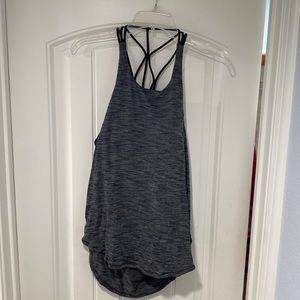 Size 8 Lululemon workout tank. Dark gray, lightly worn, crisscross back